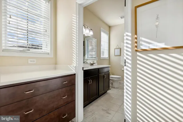 a bathroom with a double vanity sink and a bathtub
