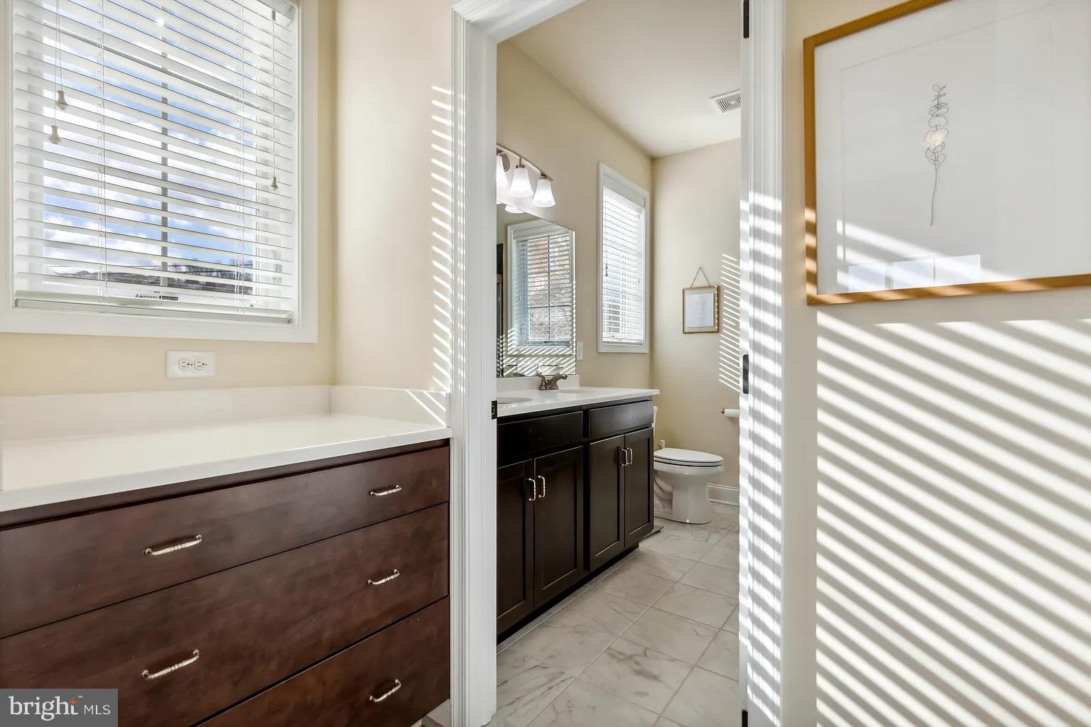 103 Front Street Conshohocken, PA 19428 - Photo 26 of 34 a bathroom with a double vanity sink and a bathtub
