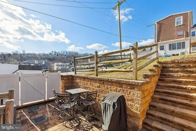 a view of a balcony with two windows