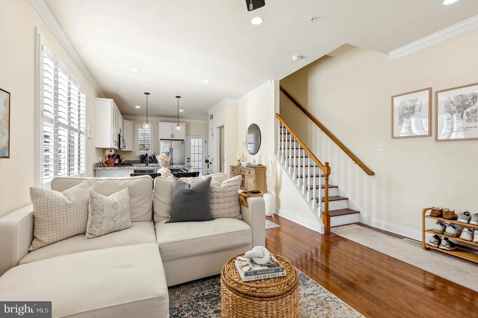 103 Front Street Conshohocken, PA 19428 - Photo 4 of 34 a living room with furniture and a dining table with wooden floor