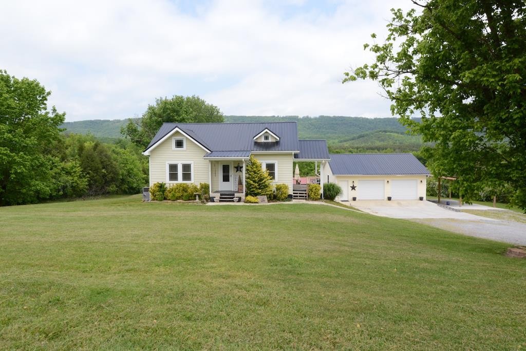 27565 Rhea County Highway Spring City, TN 37381 - Photo 1 of 30 a front view of house with yard and green space