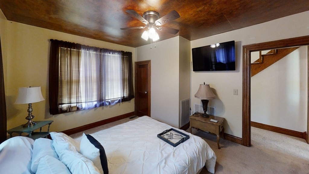 27565 Rhea County Highway Spring City, TN 37381 - Photo 13 of 30 a bedroom with a bed and a television