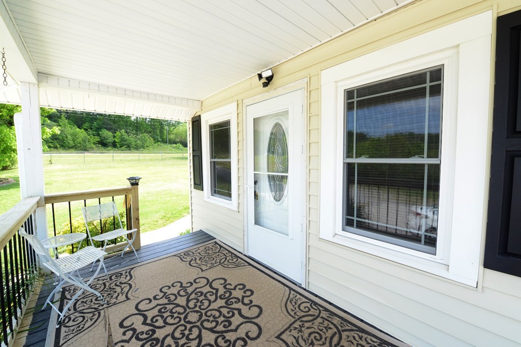 27565 Rhea County Highway Spring City, TN 37381 - Photo 3 of 30 a view of a balcony with wooden floor