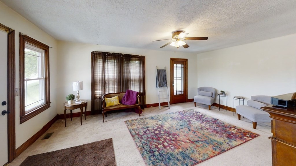 27565 Rhea County Highway Spring City, TN 37381 - Photo 4 of 30 a living room with furniture and a rug