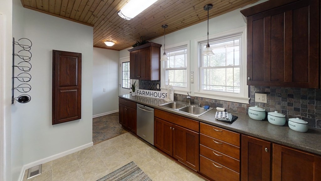 27565 Rhea County Highway Spring City, TN 37381 - Photo 9 of 30 a kitchen with stainless steel appliances granite countertop a sink stove and refrigerator