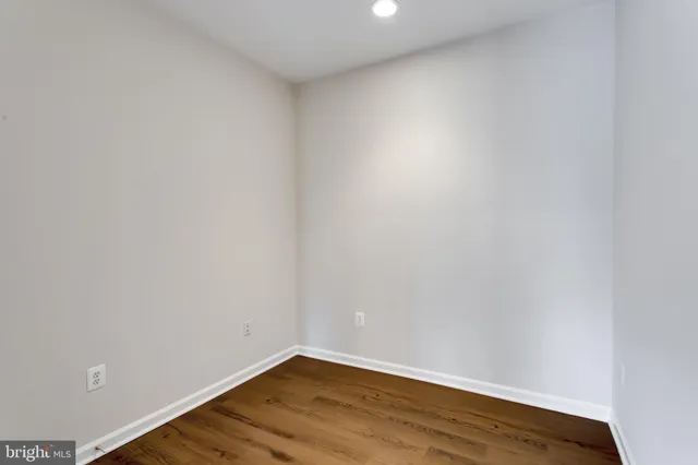 a bathroom with a double vanity sink mirror and toilet