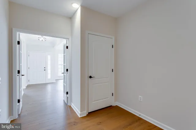 a bathroom with a double vanity sink toilet and a mirror