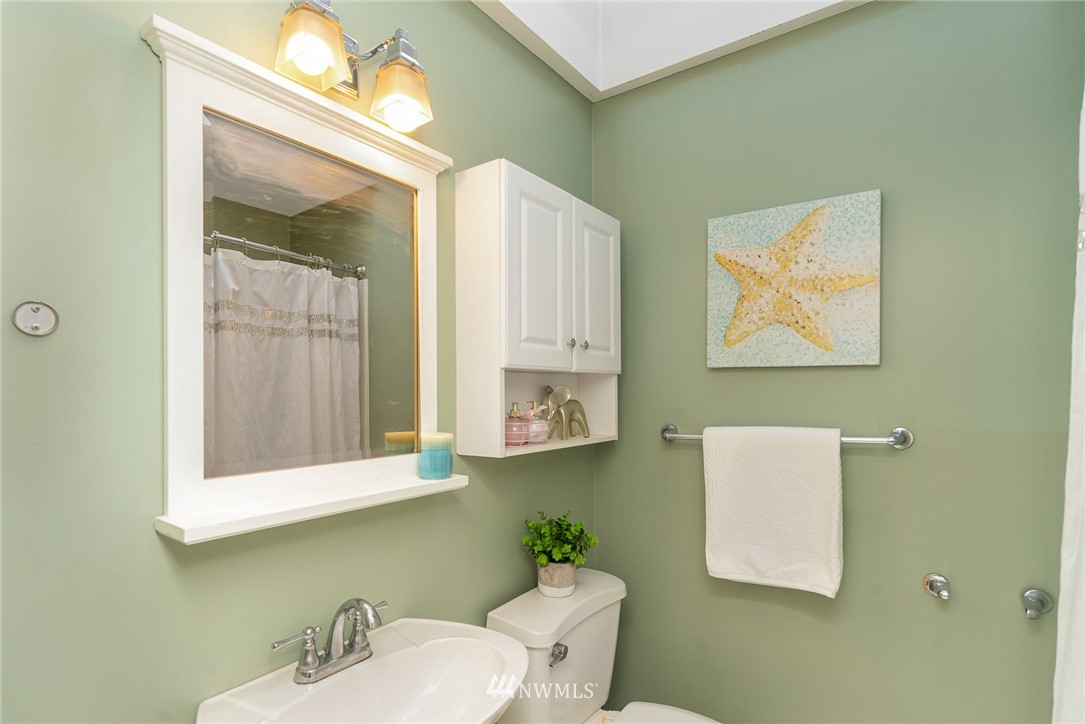 9215 Northeast 183rd Street Bothell, WA 98011 - Photo 11 of 38 a bathroom with a sink and a mirror