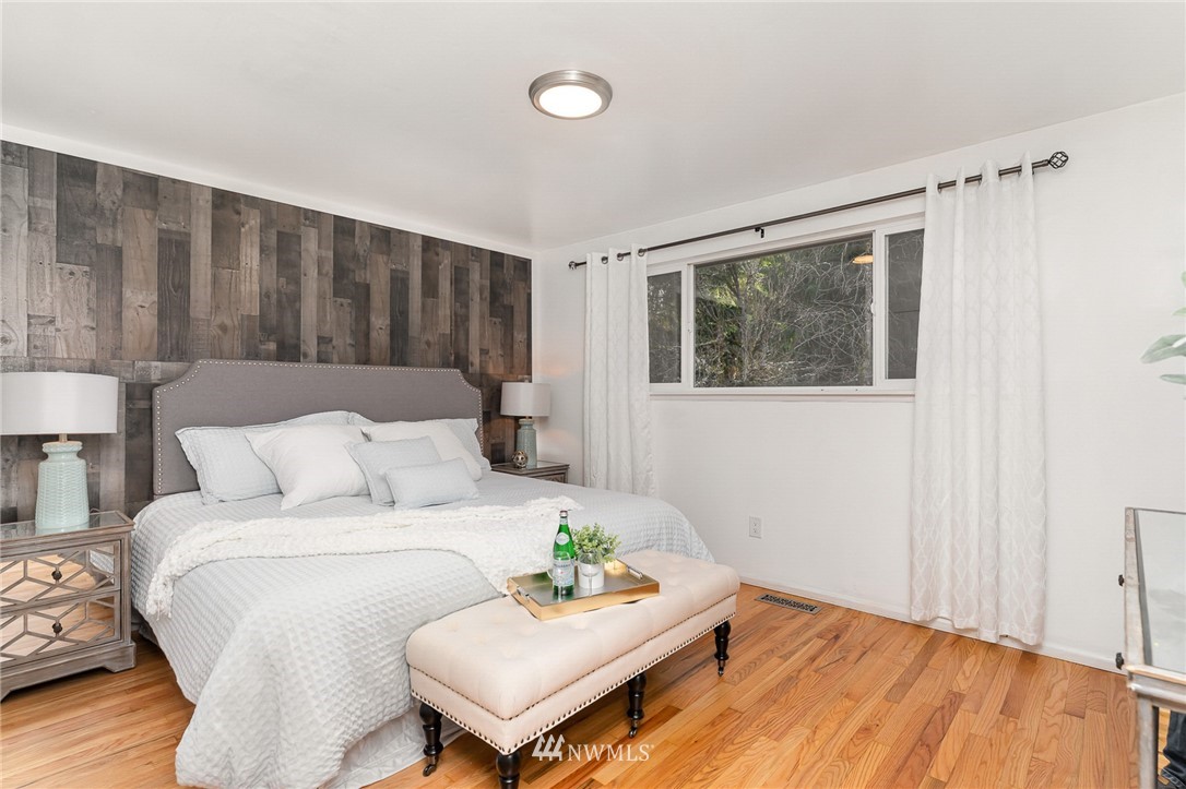 9215 Northeast 183rd Street Bothell, WA 98011 - Photo 12 of 38 a living room with furniture and a wooden floor