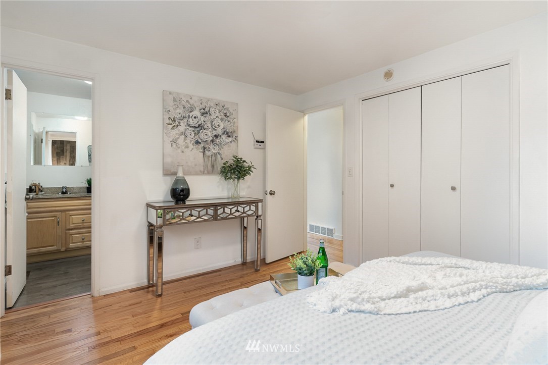 9215 Northeast 183rd Street Bothell, WA 98011 - Photo 13 of 38 a bedroom with a bed and a sink