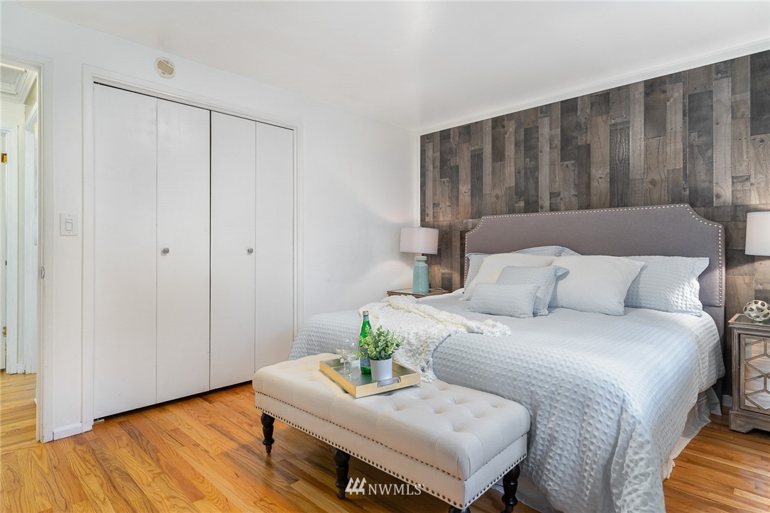 9215 Northeast 183rd Street Bothell, WA 98011 - Photo 15 of 38 a bedroom with a bed and a couch