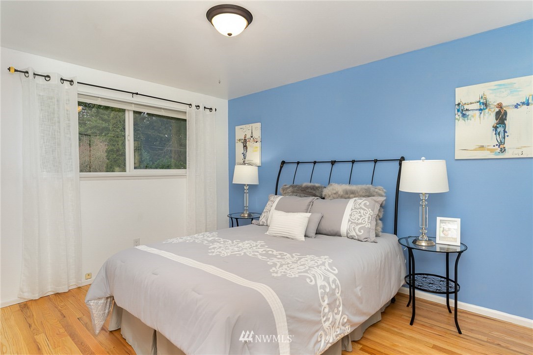 9215 Northeast 183rd Street Bothell, WA 98011 - Photo 17 of 38 a bedroom with a bed and a night stand