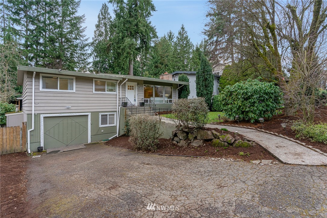 9215 Northeast 183rd Street Bothell, WA 98011 - Photo 2 of 38 a view of a house with a yard and garage