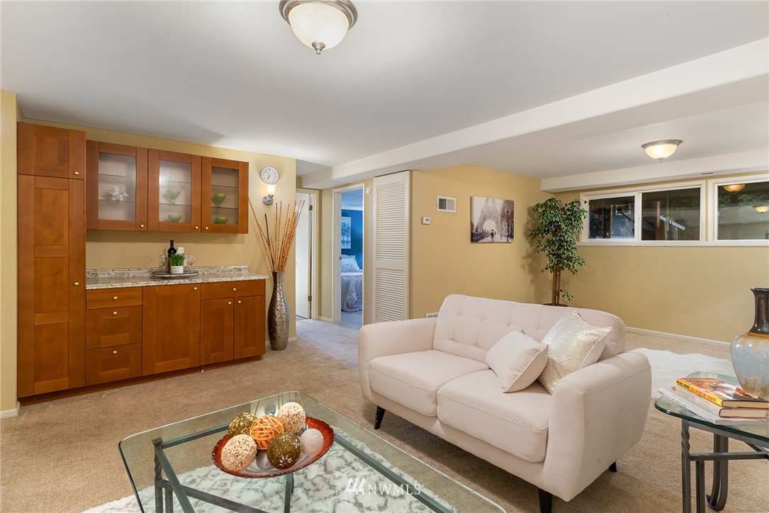 9215 Northeast 183rd Street Bothell, WA 98011 - Photo 29 of 38 a living room with furniture and a window
