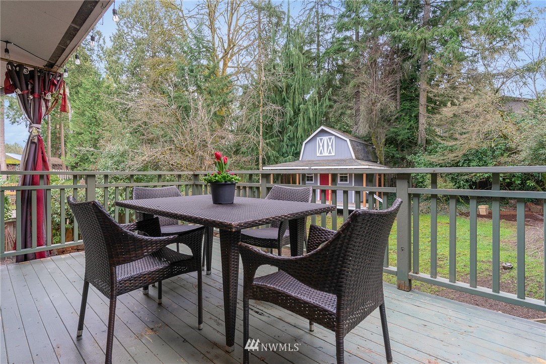 9215 Northeast 183rd Street Bothell, WA 98011 - Photo 30 of 38 a view of a chairs and table on the deck