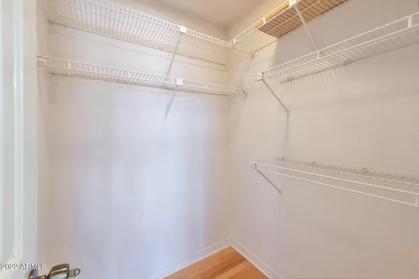 a view of a room with racks on the wall