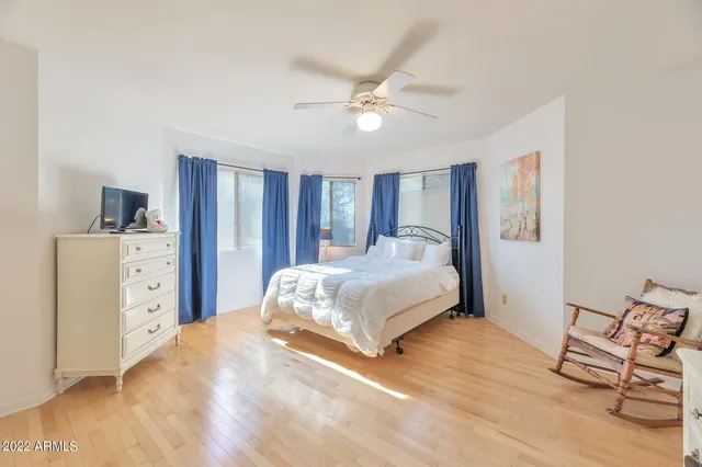 a bedroom with a bed and a cabinets
