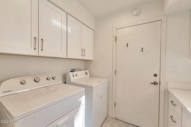 a view of storage and utility room with washer and dryer