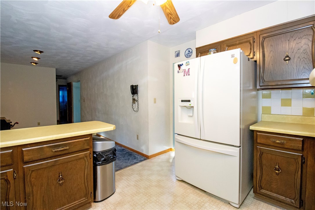 1675 South Funk Road Wooster, OH 44691 - Photo 13 of 34 Kitchen with ceiling fan and white fridge with ice dispenser