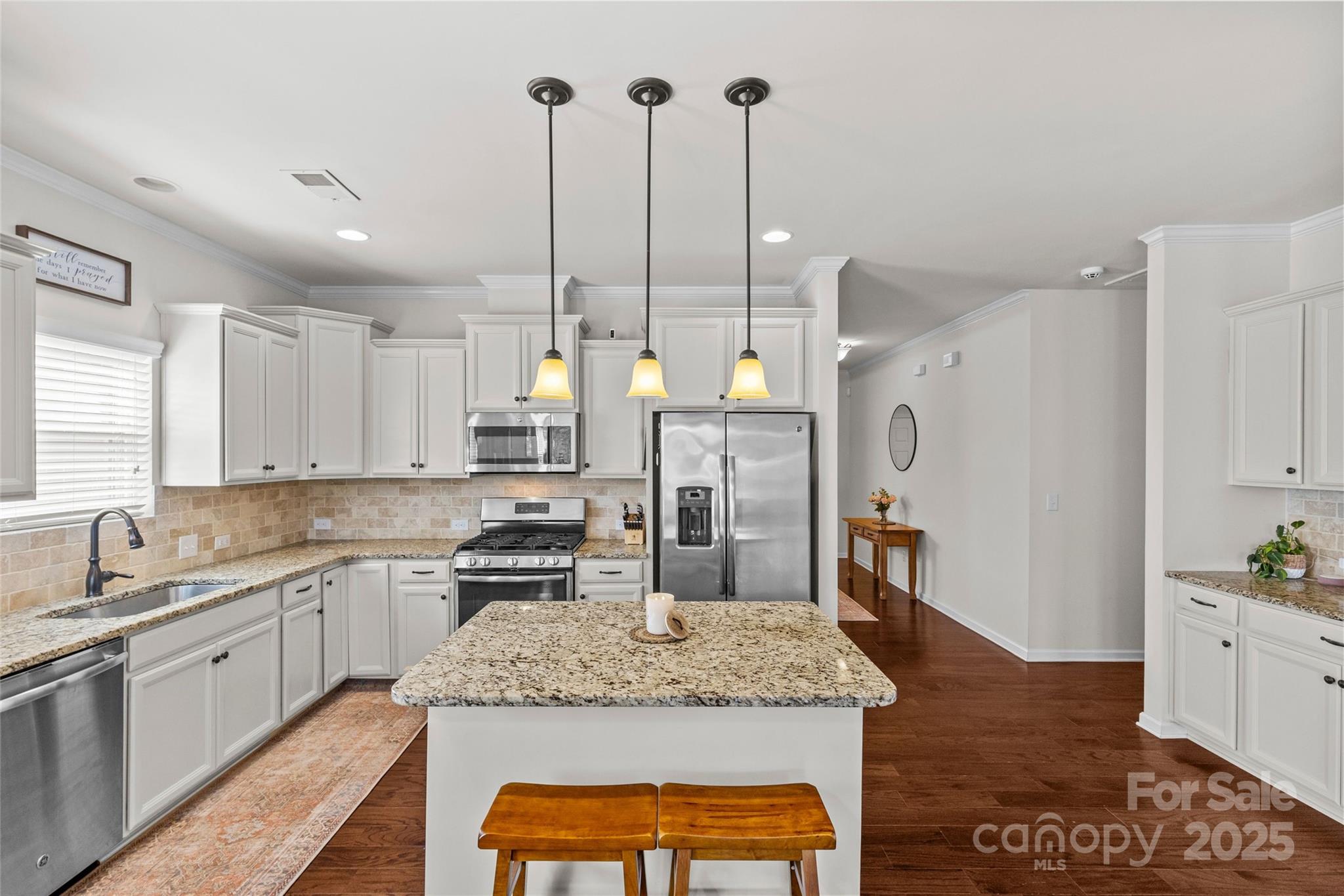 5828 Eleanor Rigby Road Charlotte, NC 28278 - Photo 11 of 39 a kitchen with stainless steel appliances granite countertop sink stove and refrigerator