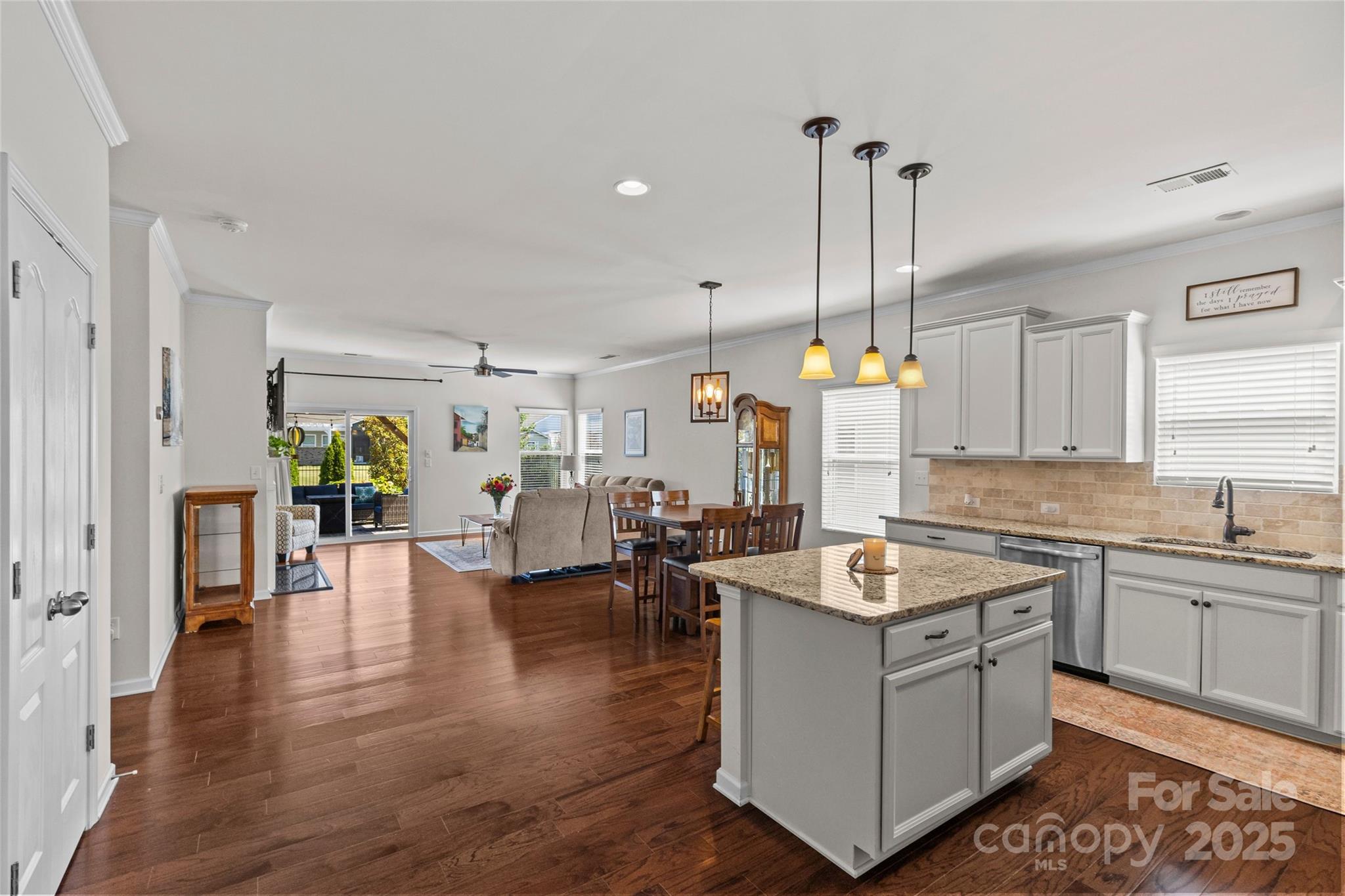 5828 Eleanor Rigby Road Charlotte, NC 28278 - Photo 20 of 39 a open kitchen with sink cabinets and wooden floor