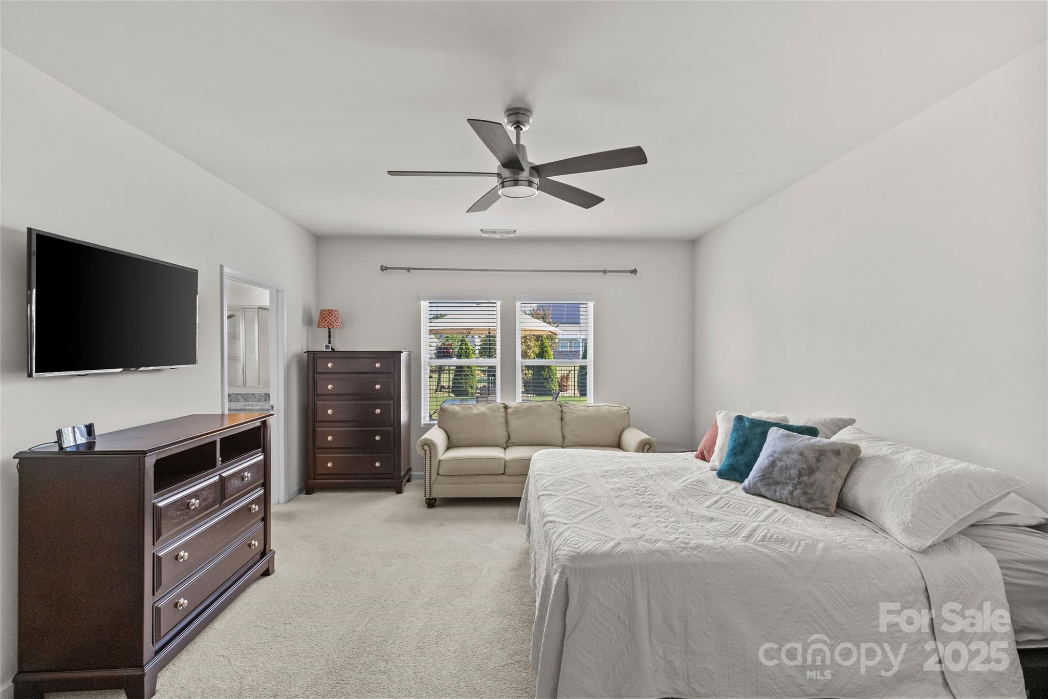 5828 Eleanor Rigby Road Charlotte, NC 28278 - Photo 22 of 39 a bedroom with a bed and a flat screen tv