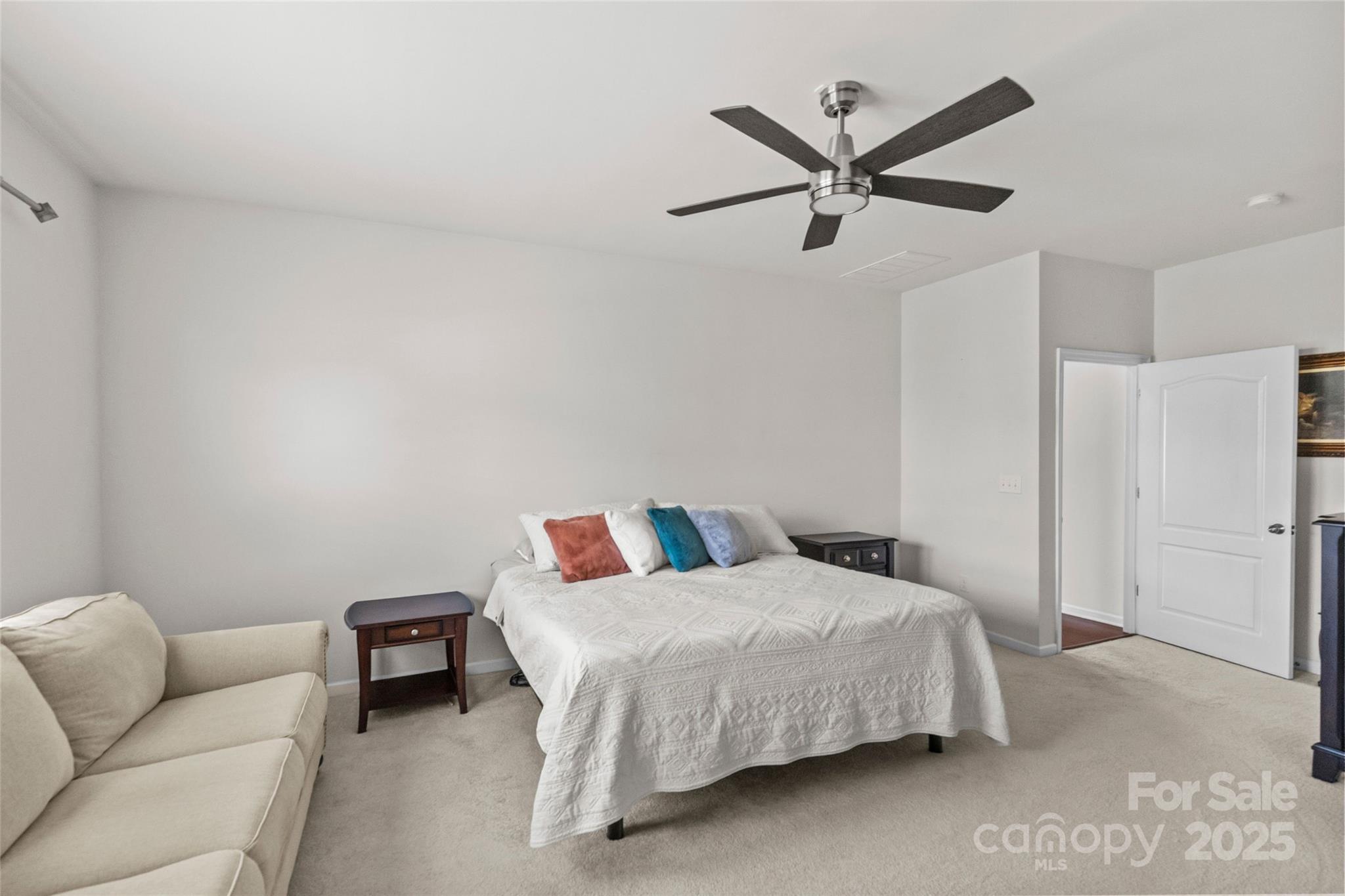 5828 Eleanor Rigby Road Charlotte, NC 28278 - Photo 23 of 39 a bedroom with a bed furniture and a ceiling fan