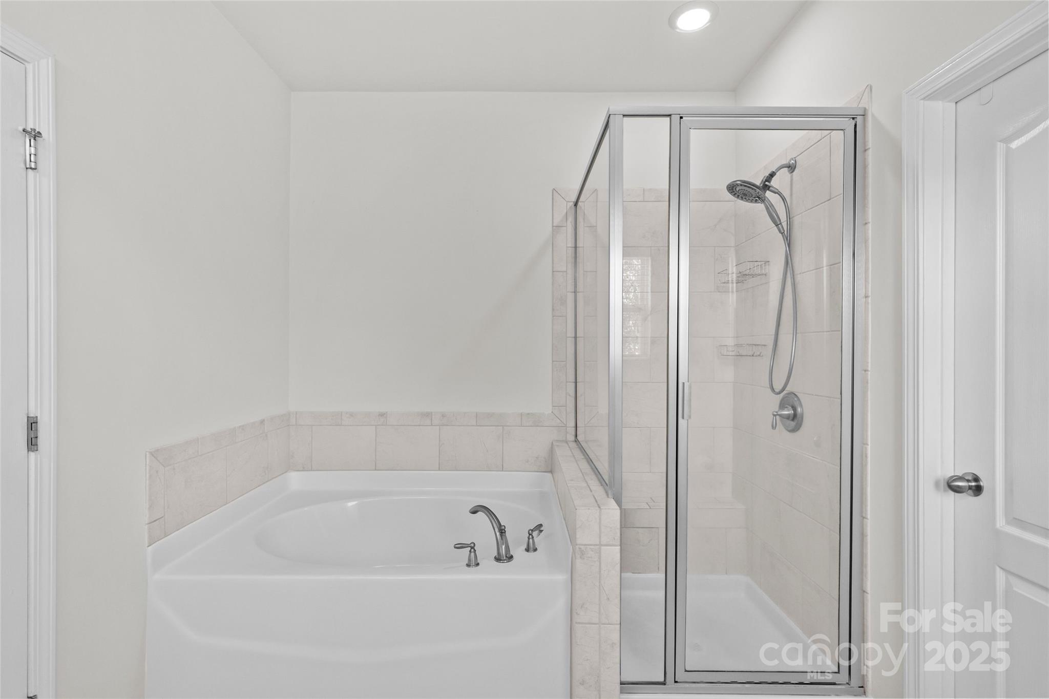 5828 Eleanor Rigby Road Charlotte, NC 28278 - Photo 28 of 39 a bathroom with a shower and a bath tub