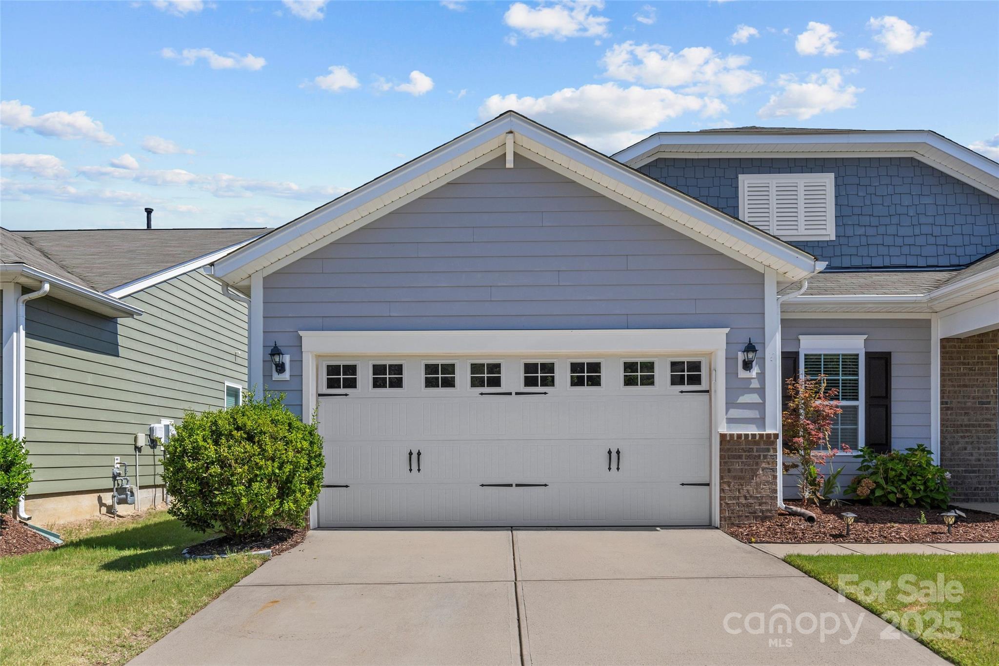5828 Eleanor Rigby Road Charlotte, NC 28278 - Photo 3 of 39 a front view of a house with a garden