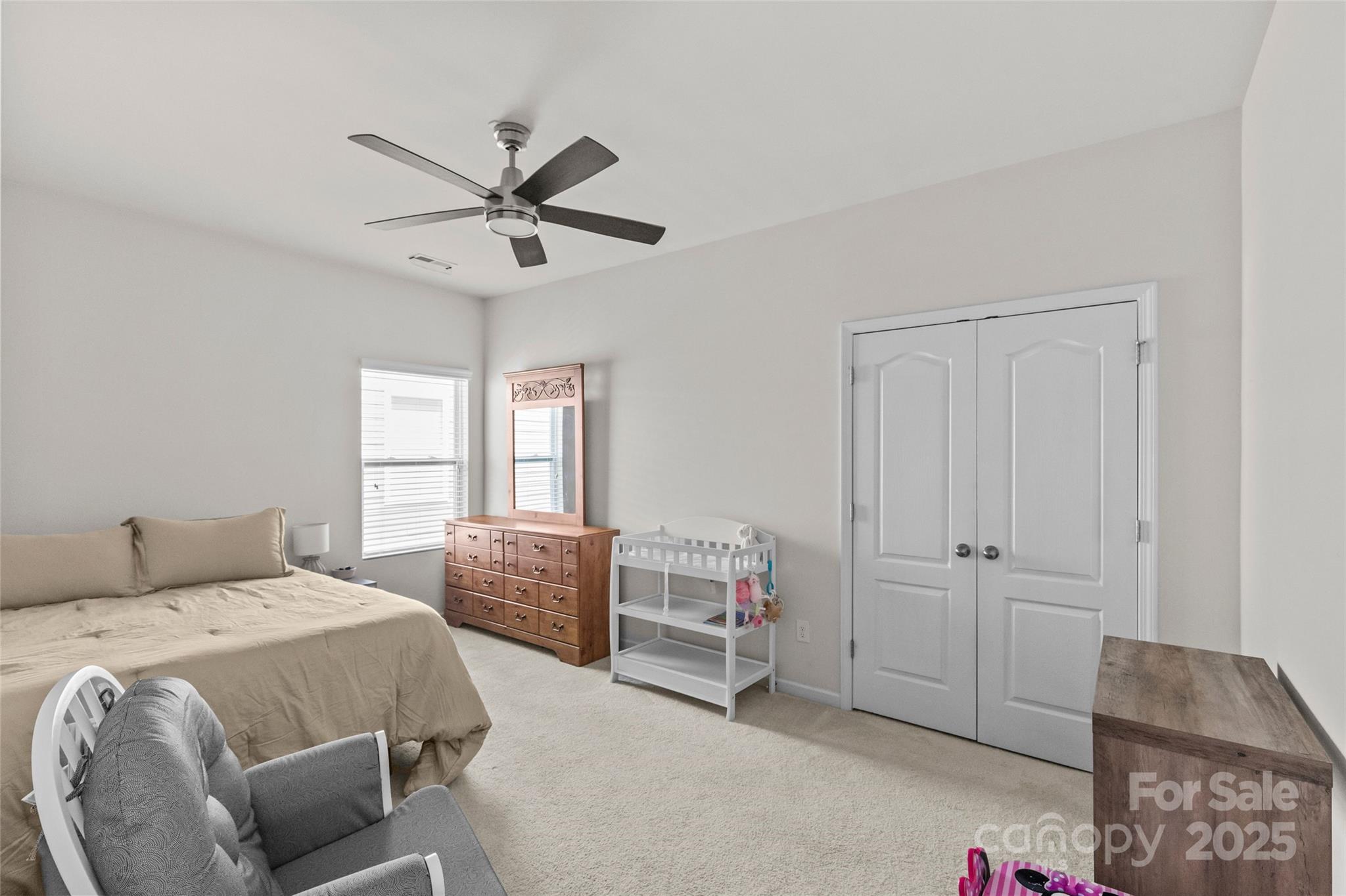 5828 Eleanor Rigby Road Charlotte, NC 28278 - Photo 31 of 39 a bedroom with a bed and a dresser