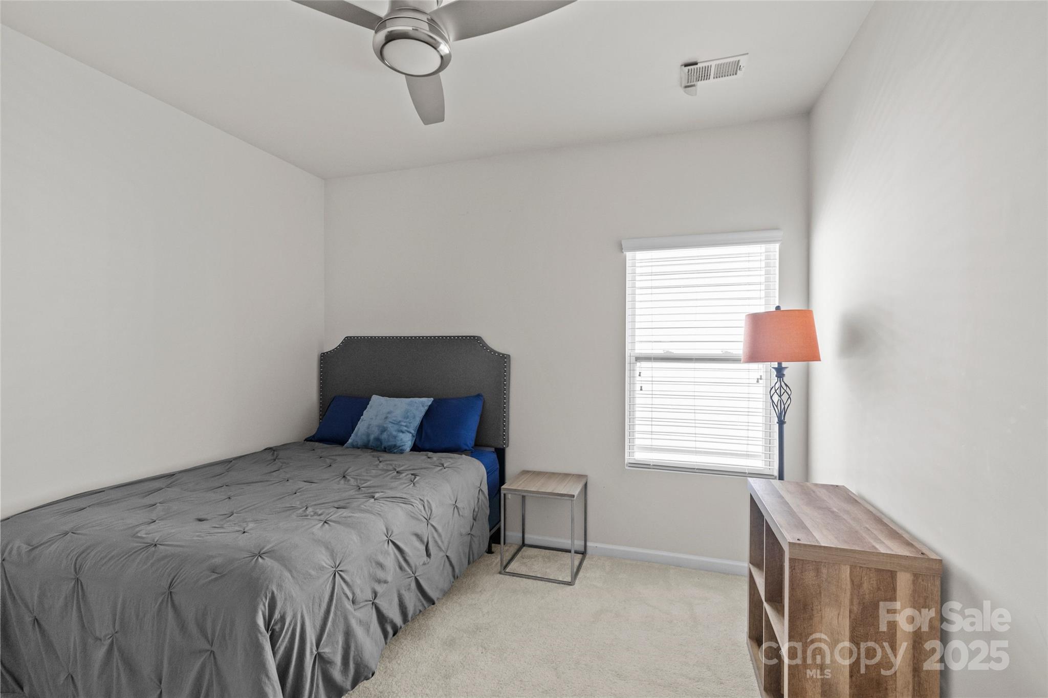 5828 Eleanor Rigby Road Charlotte, NC 28278 - Photo 32 of 39 a bedroom with a bed and window