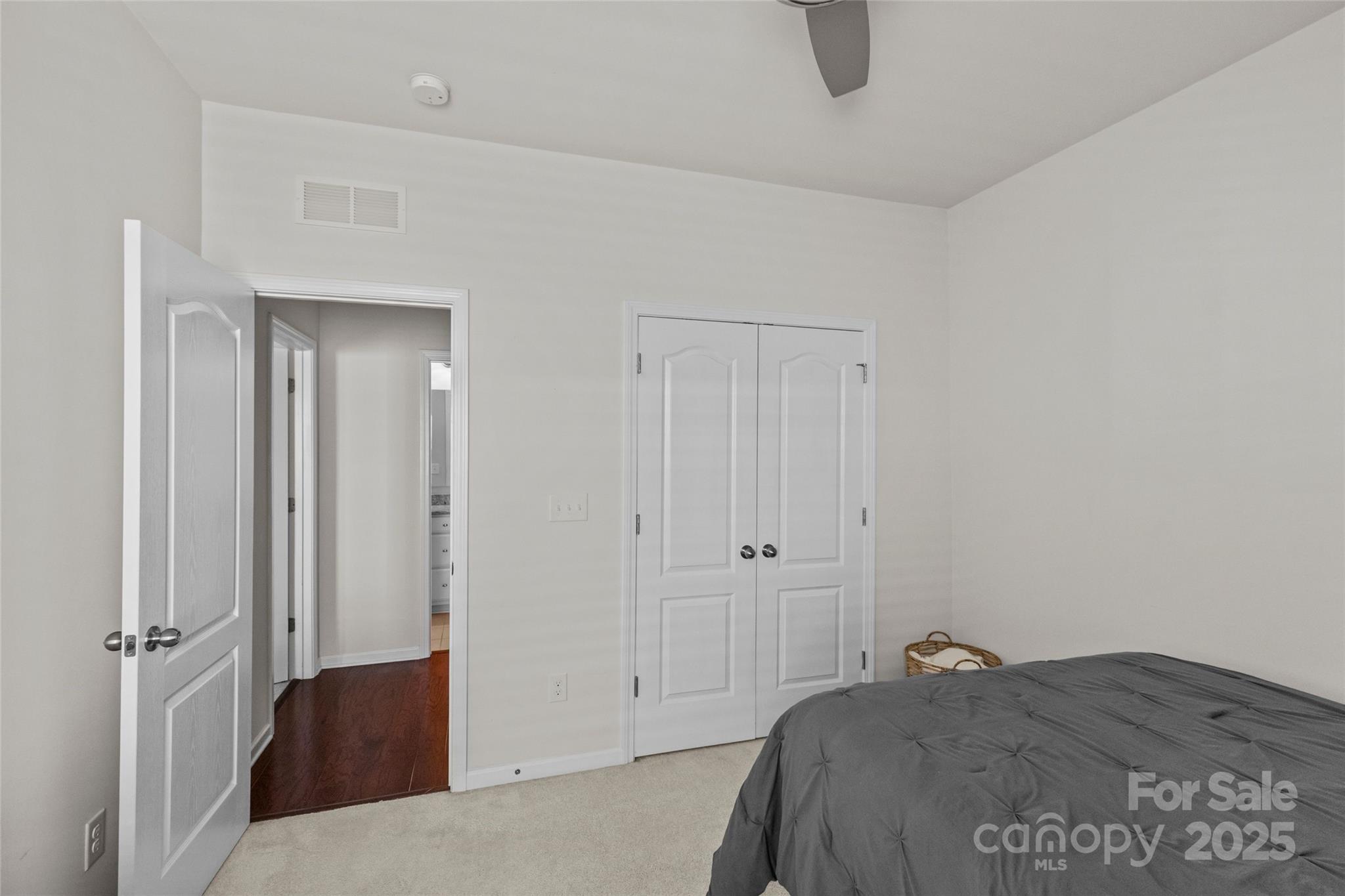 5828 Eleanor Rigby Road Charlotte, NC 28278 - Photo 33 of 39 a bedroom with a bed and a table