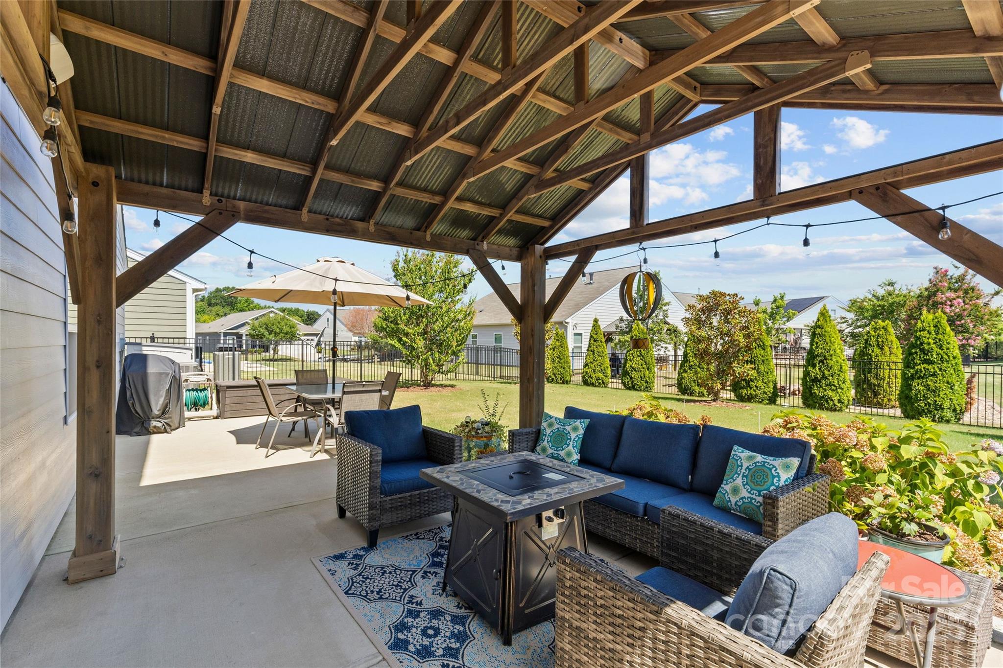 5828 Eleanor Rigby Road Charlotte, NC 28278 - Photo 36 of 39 a outdoor space with patio lots of furniture