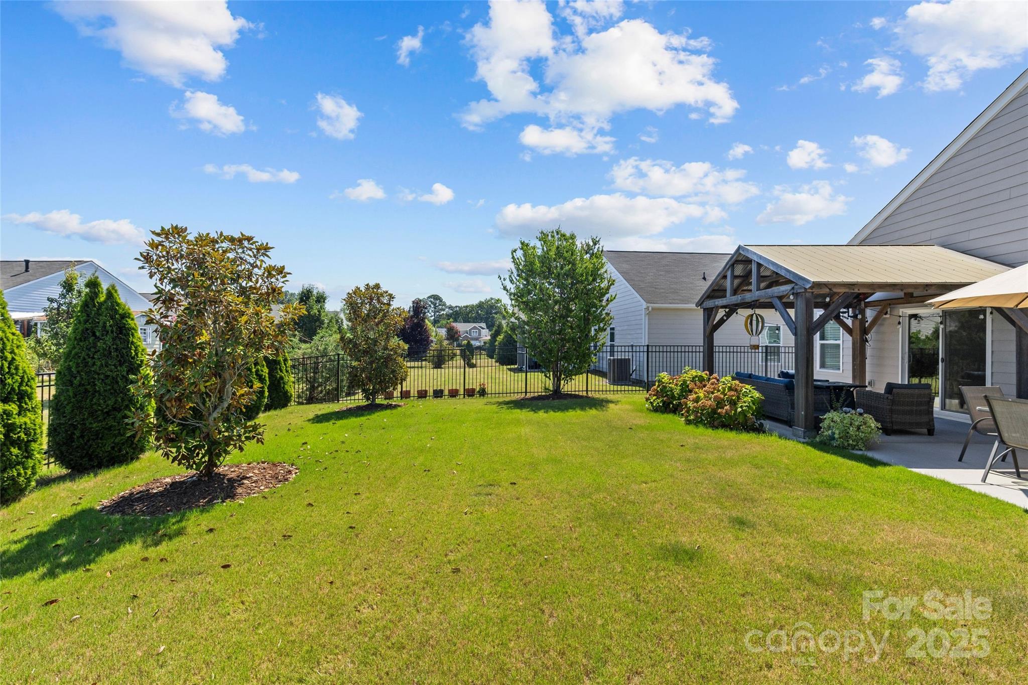 5828 Eleanor Rigby Road Charlotte, NC 28278 - Photo 39 of 39 a view of a house with a big yard and large trees