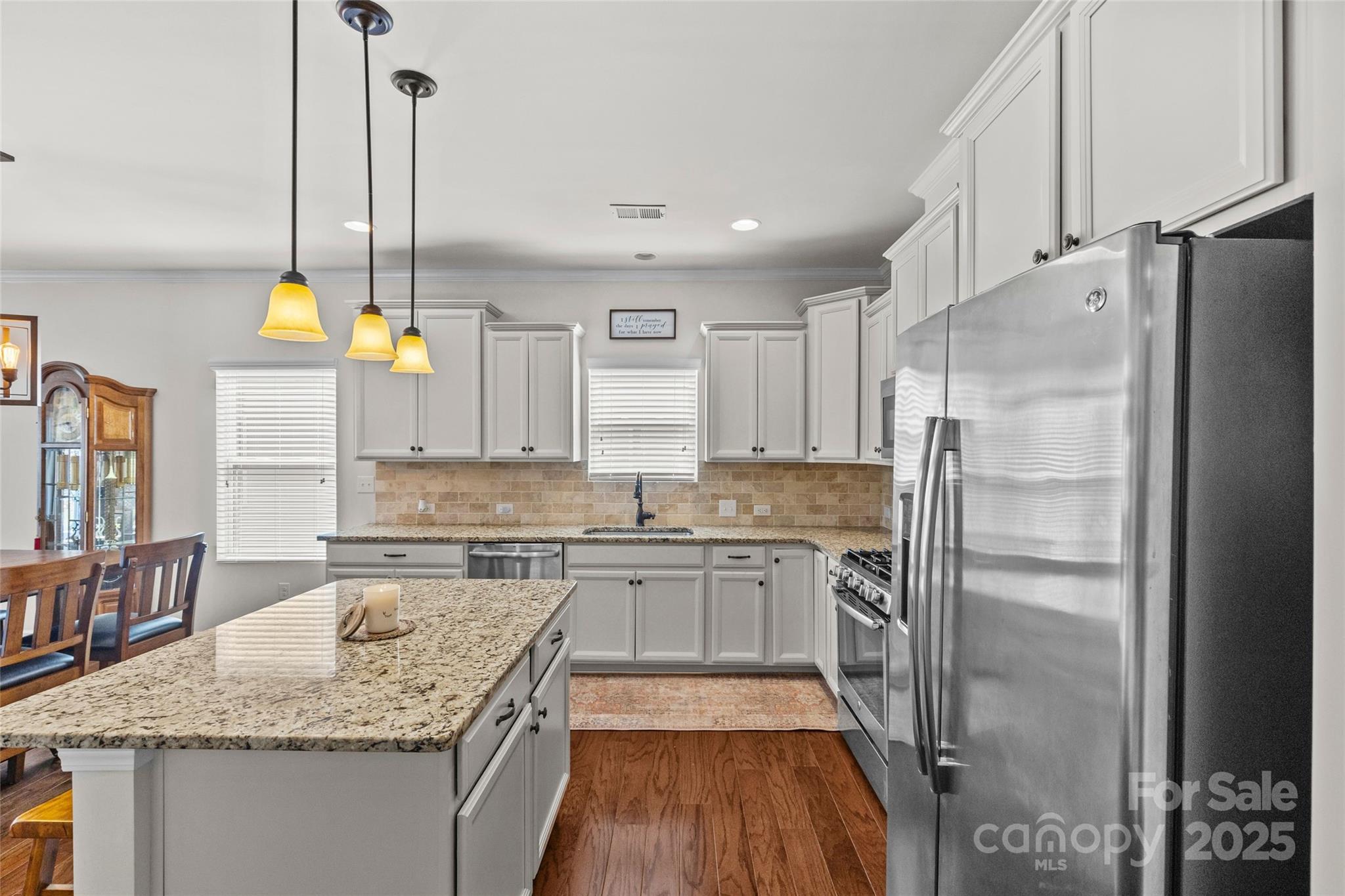 5828 Eleanor Rigby Road Charlotte, NC 28278 - Photo 10 of 39 a kitchen with stainless steel appliances granite countertop a sink stove and refrigerator