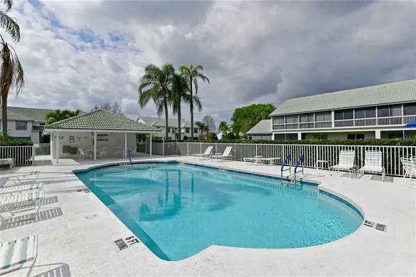 swimming pool view with a garden space
