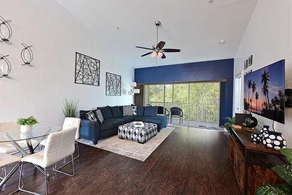 a living room with furniture and a large window