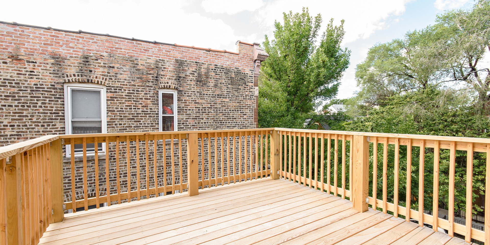 2163 North Bell Avenue, Unit 2F Chicago, IL 60647 - Photo 11 of 12 a view of a balcony with wooden floor