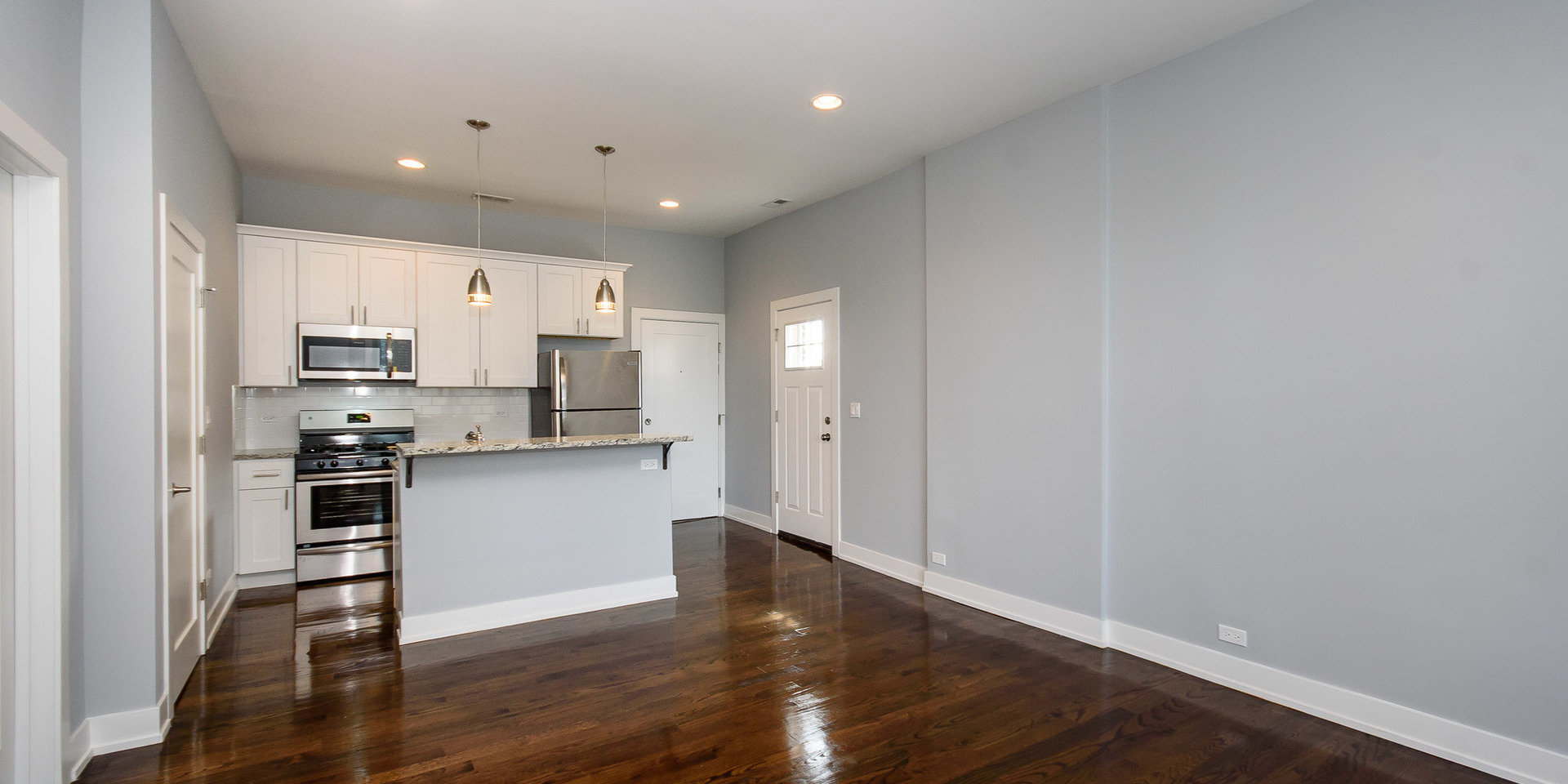 2163 North Bell Avenue, Unit 2F Chicago, IL 60647 - Photo 6 of 12 a view of kitchen with wooden floor