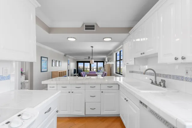 a kitchen with a sink and cabinets