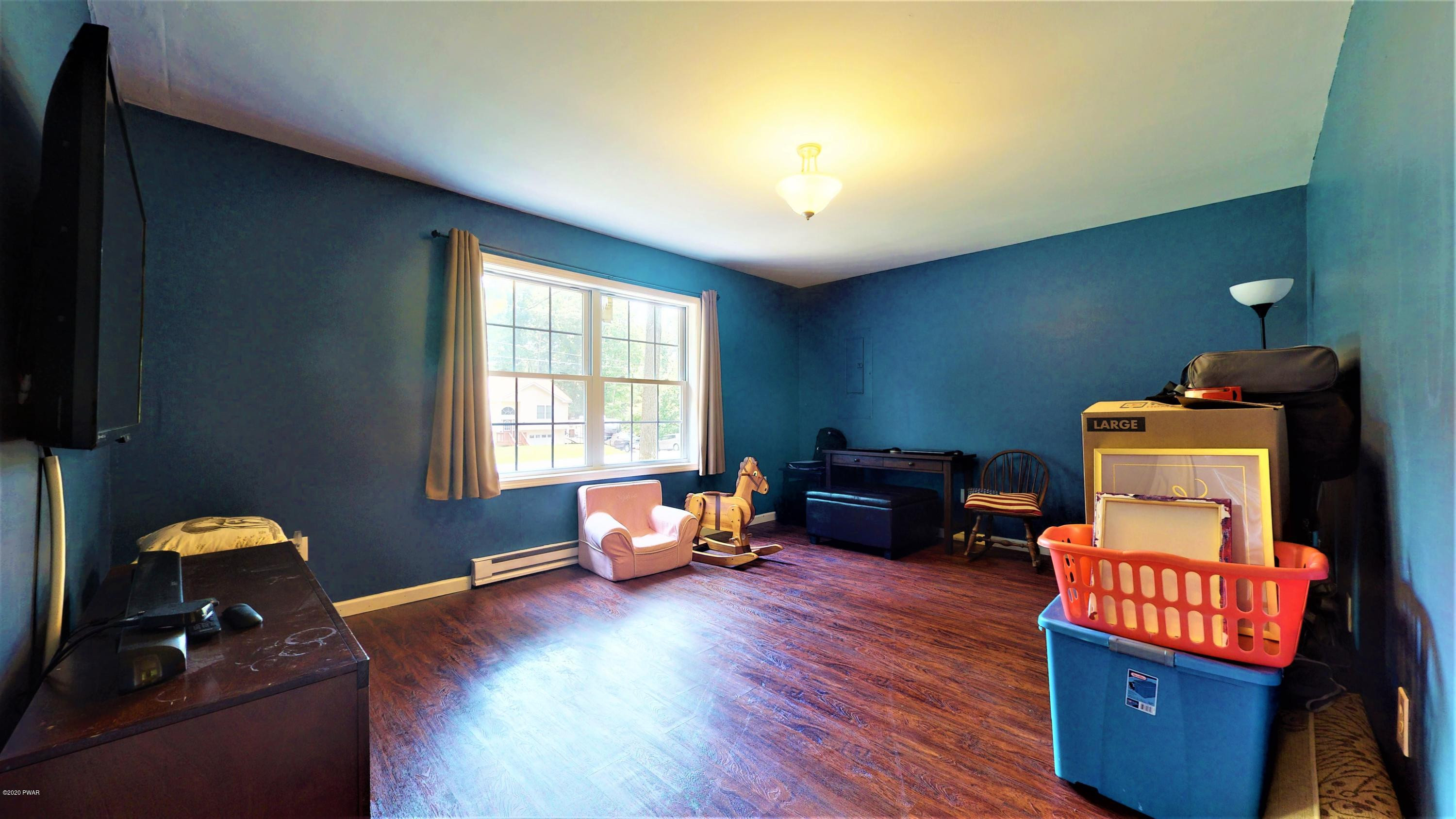 143 Raccoon Road Dingmans Ferry, PA 18328 - Photo 78 of 87 a living room with furniture and wooden floor