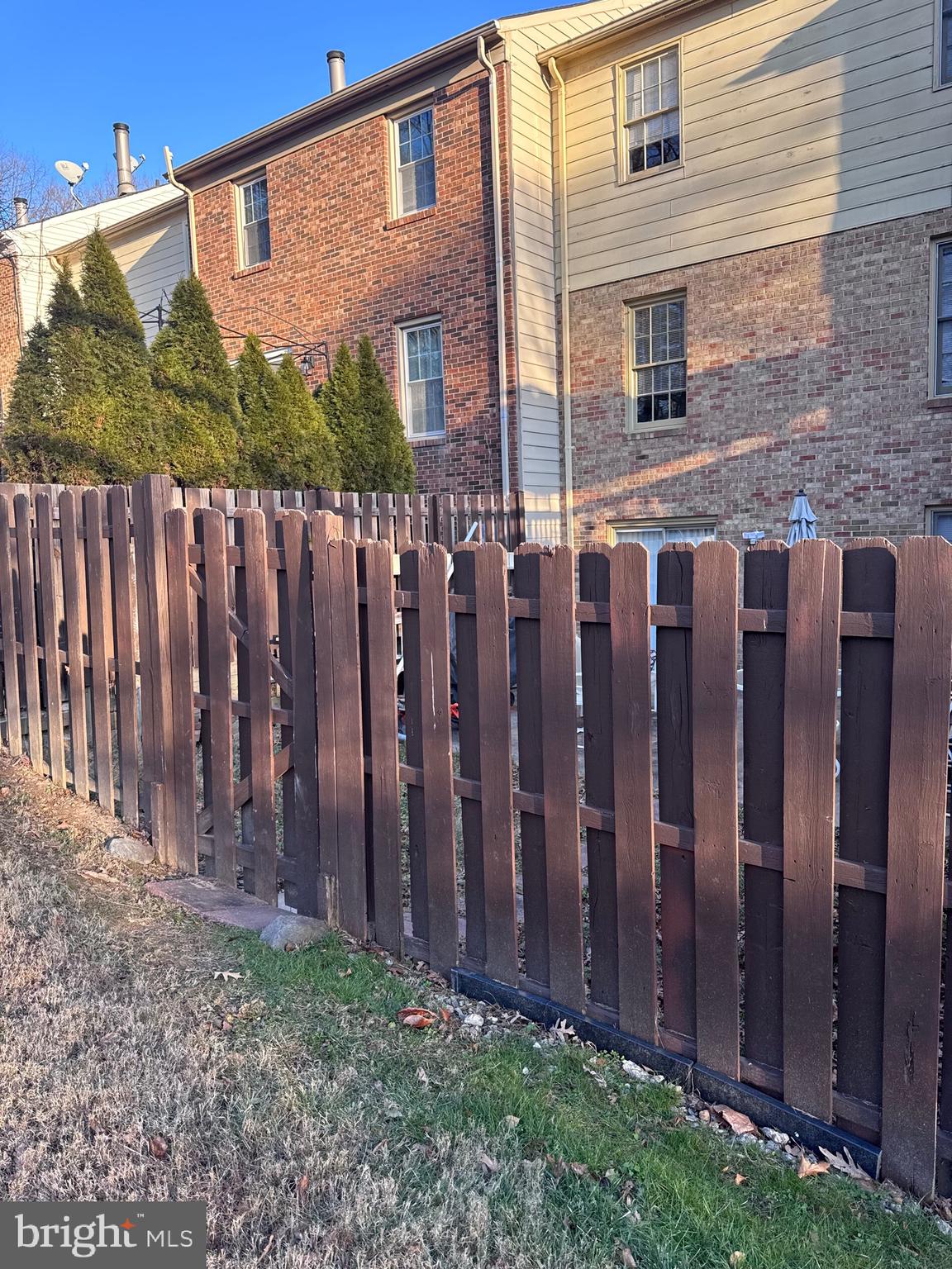 7416 Erska Woods Court Springfield, VA 22153 - Photo 13 of 18 a view of a house with a wooden fence