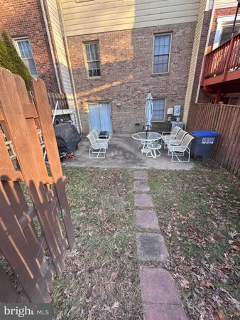 a view of a backyard with sitting area