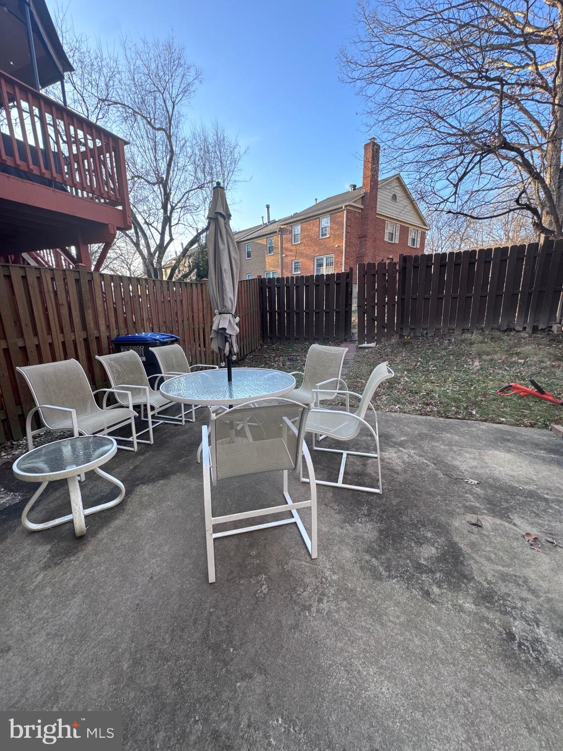 7416 Erska Woods Court Springfield, VA 22153 - Photo 17 of 18 a view of a patio with a table and chairs