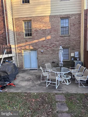 a backyard of a house with outdoor seating