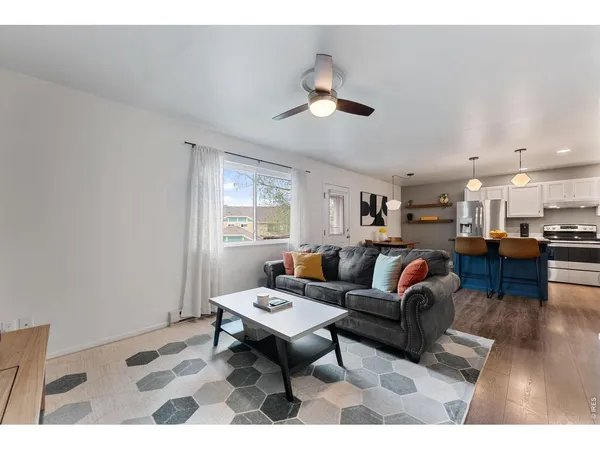 a living room with furniture and a table