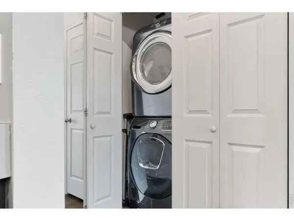 a utility room with sink dryer and washer