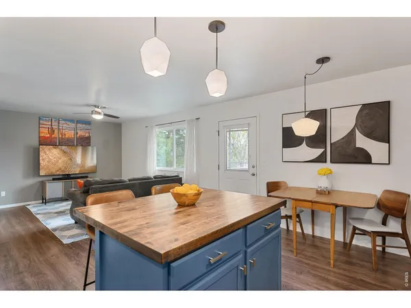 a kitchen with a table and chairs in it
