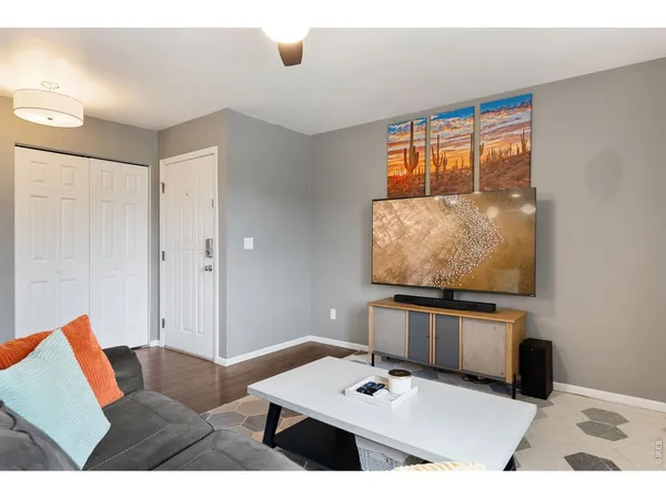 a living room with furniture and flat screen tv