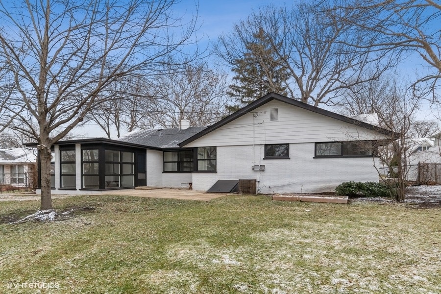 1232 Warrington Road Deerfield, IL 60015 - Photo 15 of 17 a front view of a house with a yard and garage